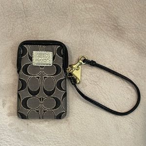 Coach Poppy Wristlet. Black and gold stitching